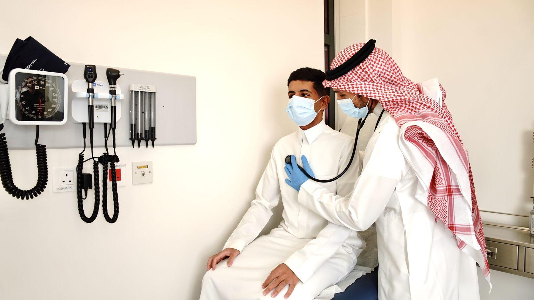 One Health doctor examining a patient with a stethoscope